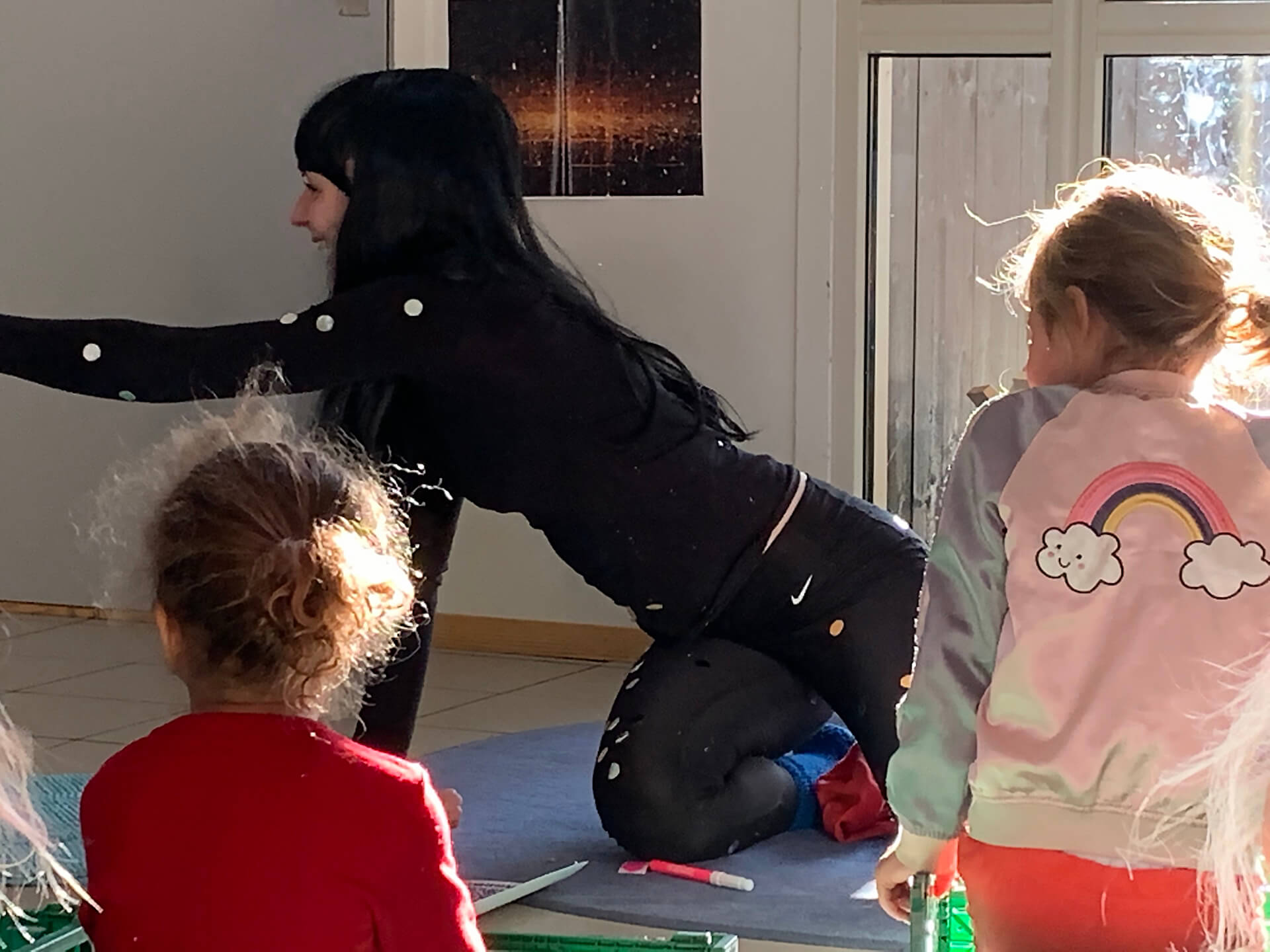 Photo of child care worker with children.